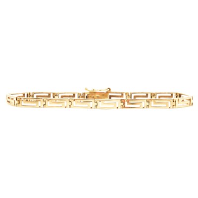 Lot 191 - A yellow metal Greek key design bracelet.
