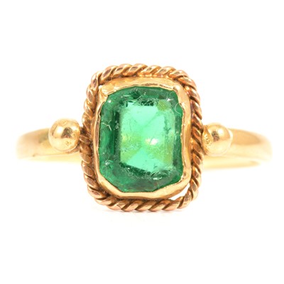 Lot 77 - A yellow gold ring set with a damaged and rubbed  green stone.