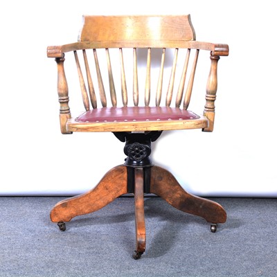 Lot 619 - Oak swivel captains chair