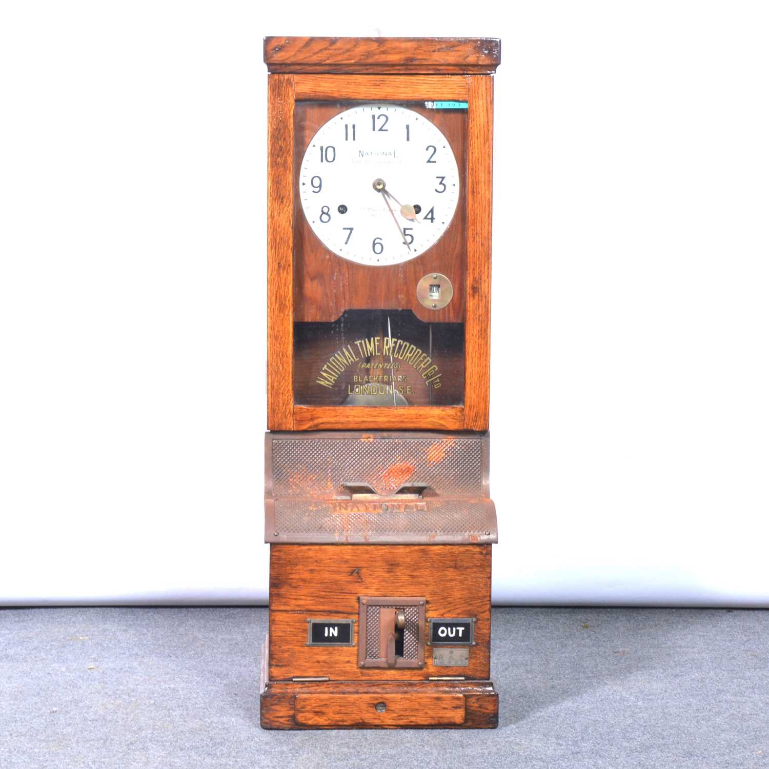 Lot 555 - A National Time Recorder with keys.