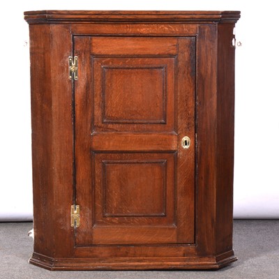 Lot 402 - George III oak hanging corner cupboard