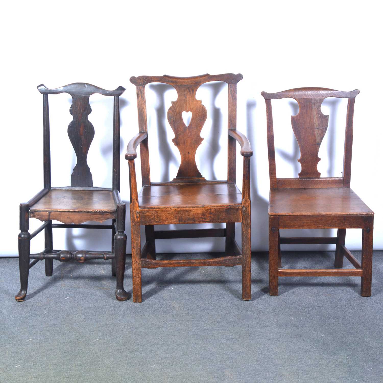 Lot 446 - Set of six 18th century oak dining chairs, plus a carver, and two associated chairs