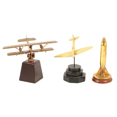 Lot 488 - Trench art shell case cigarette lighter and two brass models of aeroplanes.