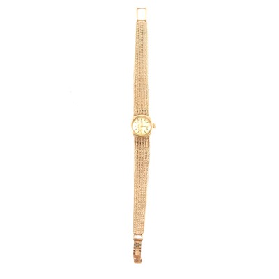 Lot 383 - Omega - a lady's 9 cart yellow gold bracelet watch.