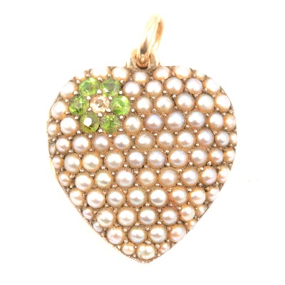 Lot 232 - A demantoid garnet and pearl heart shaped locket.