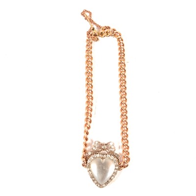 Lot 206 - A diamond and gemstone set motif on a curb link bracelet.