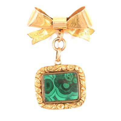 Lot 314 - A malachite fob with locket back on a modern 9 carat gold bow.