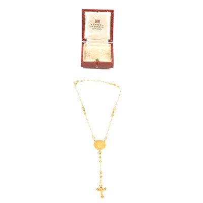 Lot 314 - A small yellow metal tenner pocket rosary in an Asprey box.