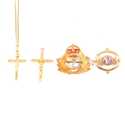 Lot 250 - A naval brooch, two crucifix and an amethyst brooch.