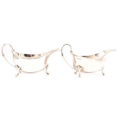 Lot 502 - A pair of silver sauce boats by Walker & Hall, Sheffield 1923.