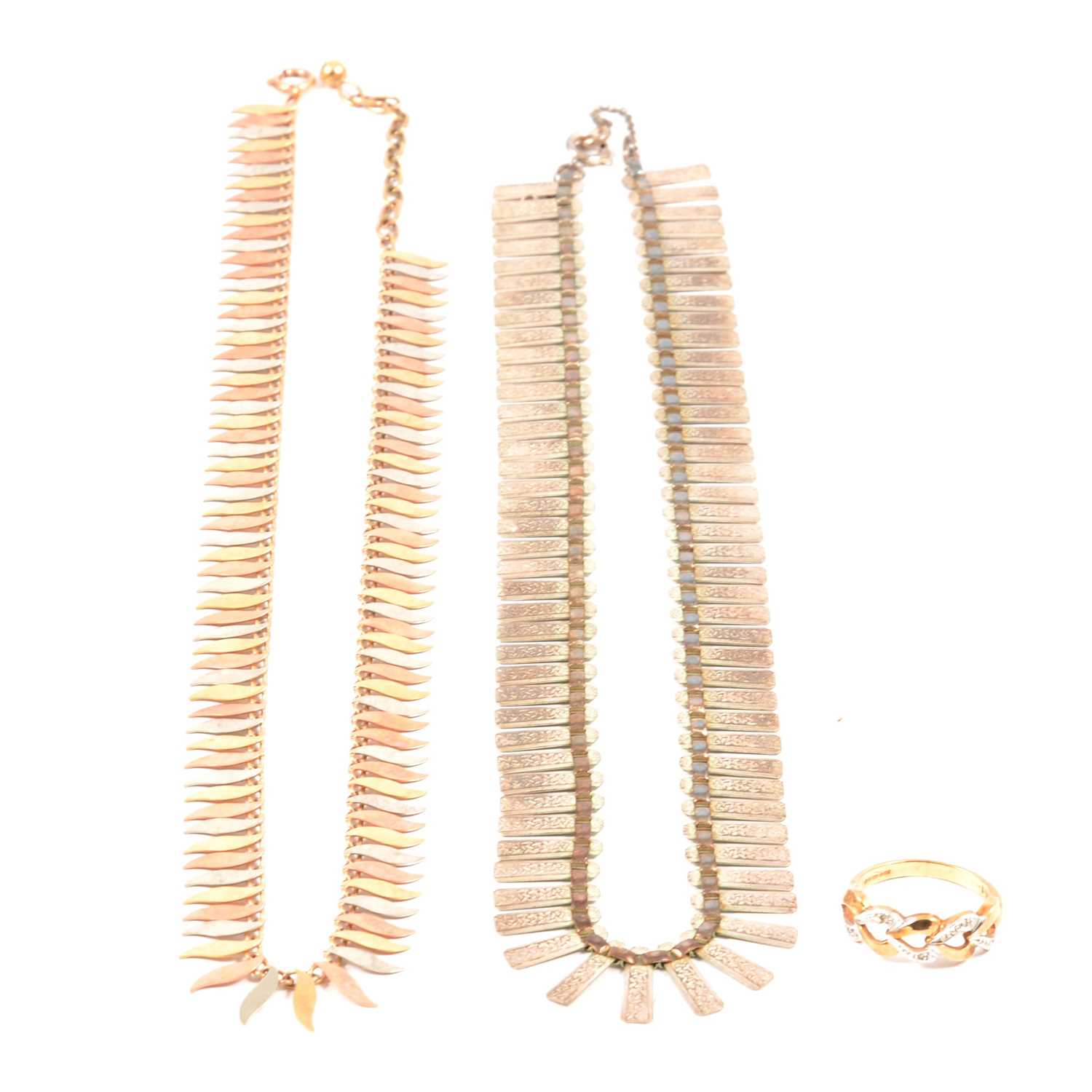 Lot 222 - A yellow, rose and white metal fringe necklace, a diamond set ring, and a silver fringe necklace.