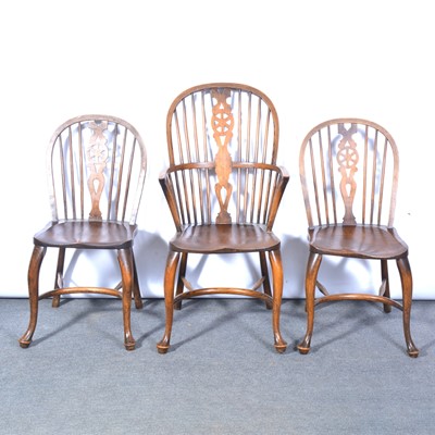 Lot 486 - Set of five modern elm and beech wheel back Windsor chairs