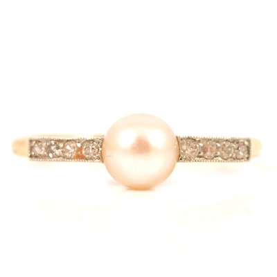 Lot 111 - A pearl and diamond dress ring.