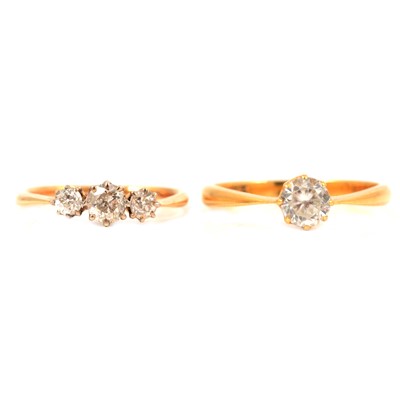 Lot 16 - A diamond three stone ring and a 22 carat solitaire with synthetic stone.