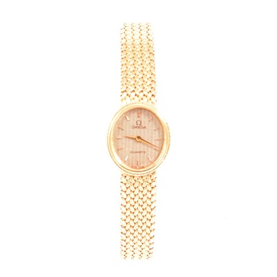 Lot 381 - Omega - a lady's 9 carat gold bracelet watch.