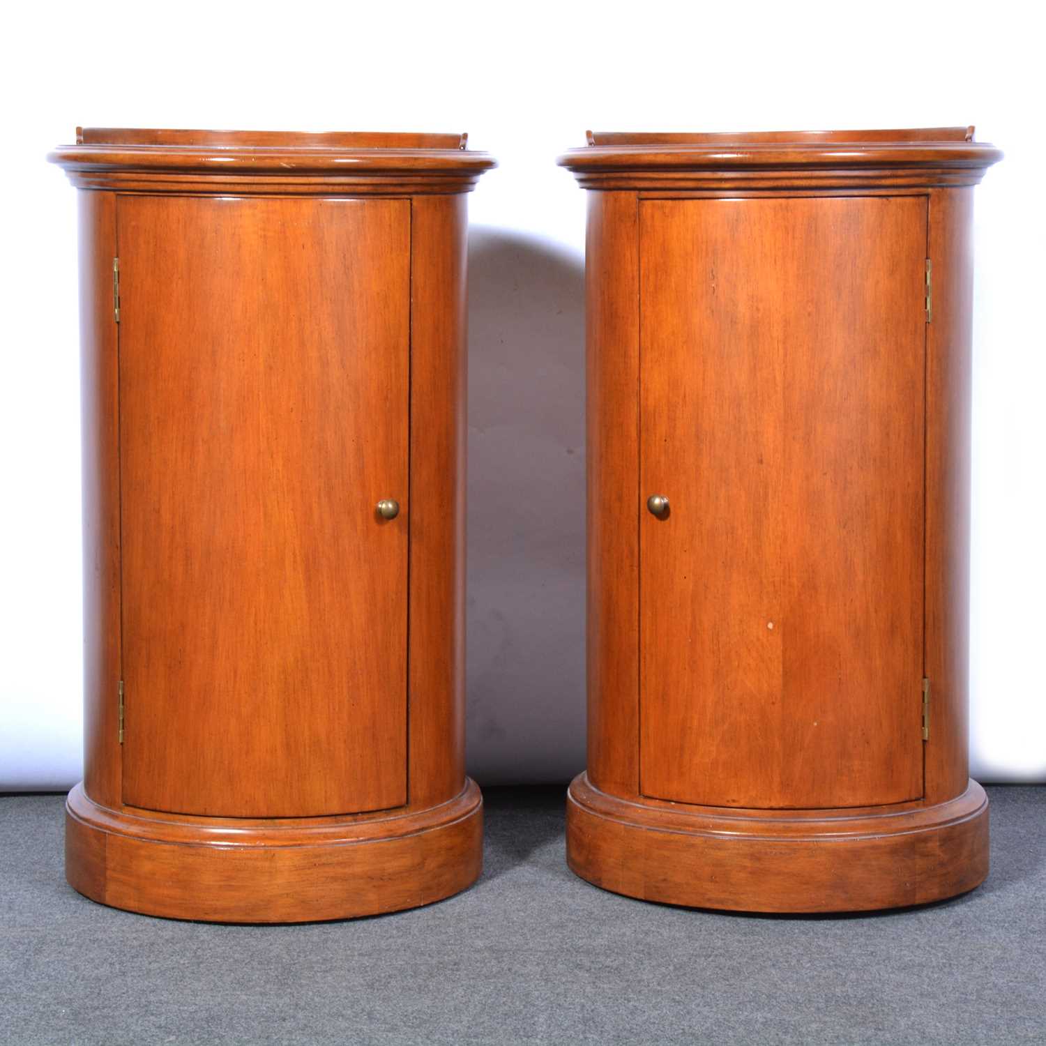 Lot 559 - Pair of modern hardwood cylinder pot cupboards