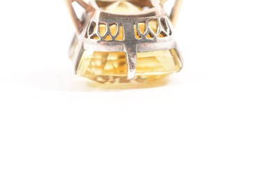 Lot 66 - A large yellow sapphire solitaire ring.
