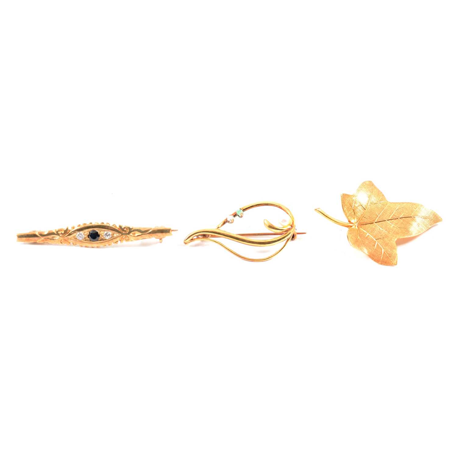 Lot 293 - Three gold brooches.