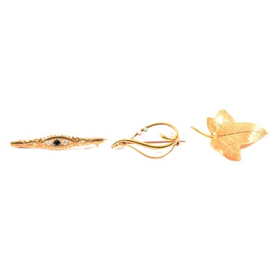 Lot 293 - Three gold brooches.