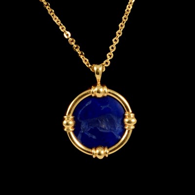 Lot 234 - A lapis lazuli zodiac pendant and chain.