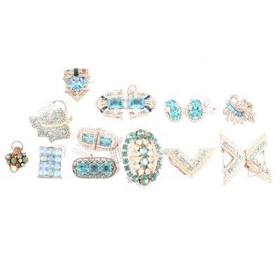 Lot 417 - Fourteen Art Deco and later faux aquamarine paste dress clips and brooches.