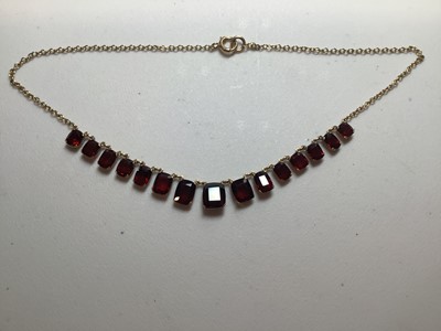Lot 228 - A garnet necklace, two pairs of peridot earrings, coral pendant.