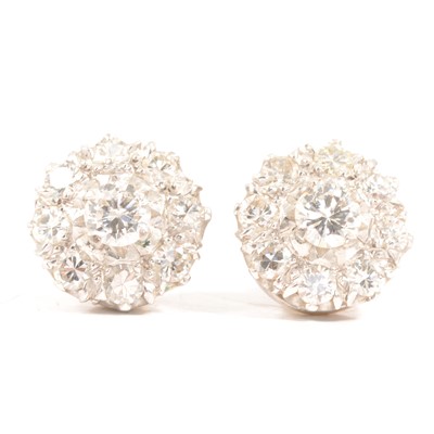 Lot 160 - A pair of diamond cluster earrings.