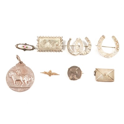 Lot 438 - A collection of Victorian and later silver brooches, stamp case.