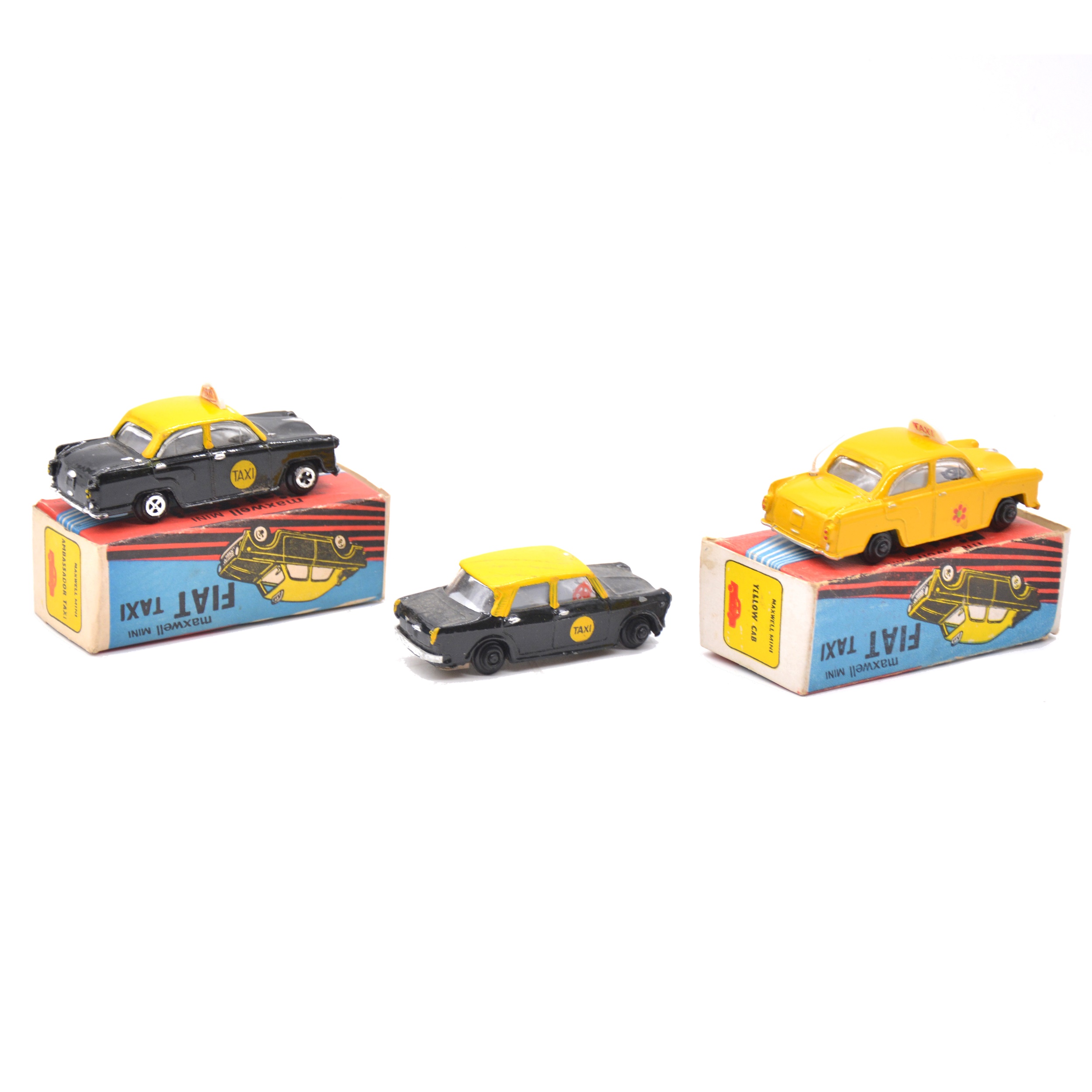 Lot 1137 Three Maxwell Mini diecast taxi models.