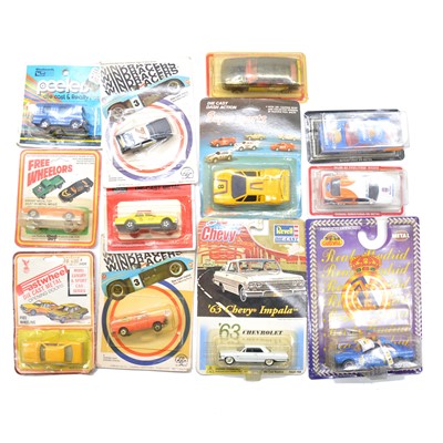 Lot 1143 - Twelve card-back model cars and vehicles, various makers