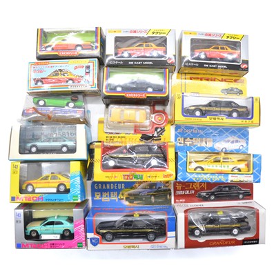 Lot 1144 - Fifteen Japanese model cars and taxis