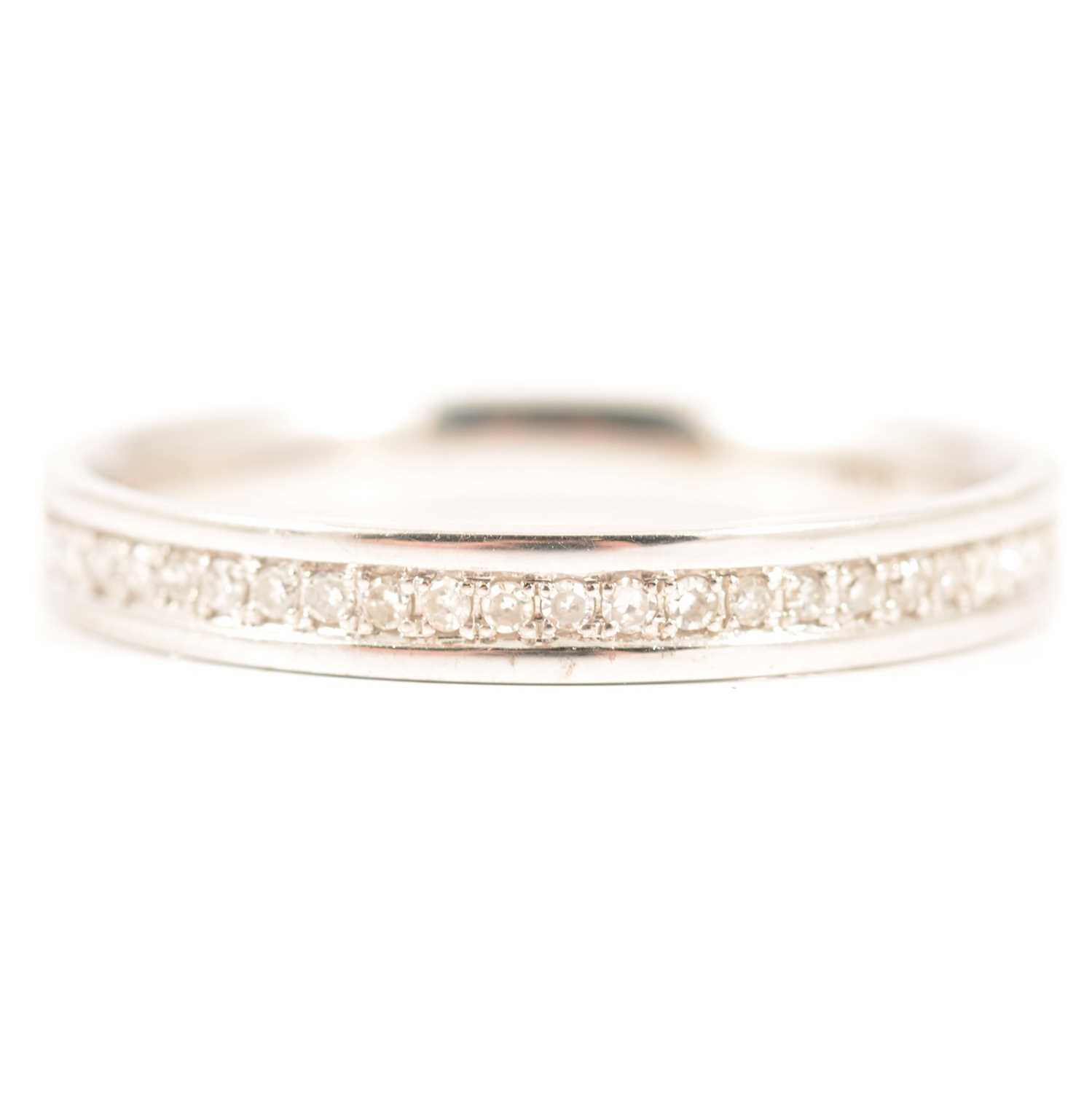 Lot 36 - A diamond half eternity ring.