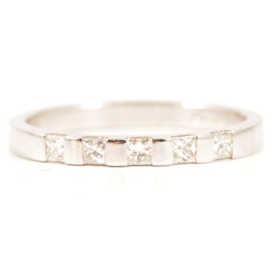 Lot 42 - A diamond half eternity ring.