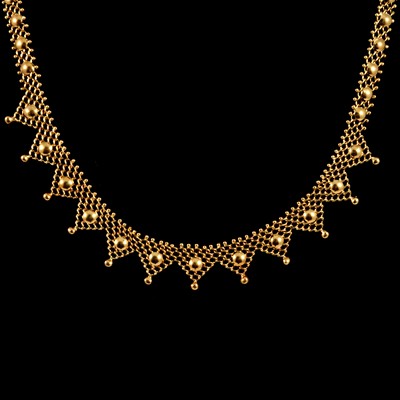 Lot 215 - A yellow metal fringe necklace.