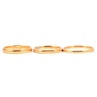 Lot 137 - Three 22 carat gold wedding bands.