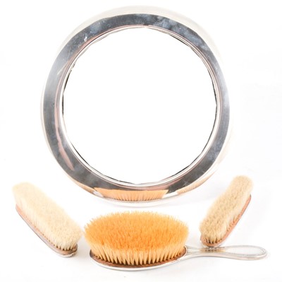 Lot 401 - Silver plated dressing table mirror and three brushes