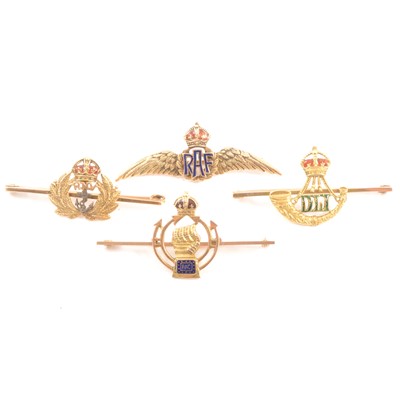 Lot 265 - Four yellow metal military brooches.