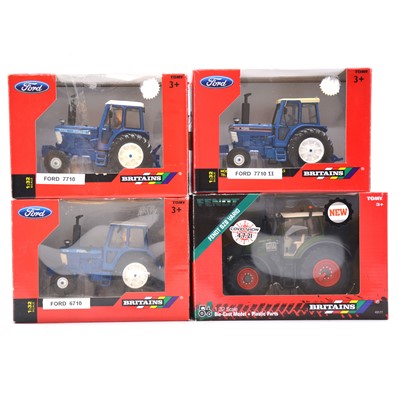 Lot 1226 - Four Britains model tractors, boxed.