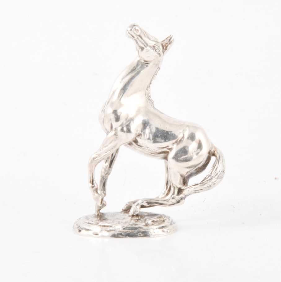 Lot 220 - Cast silver model of a rearing horse,