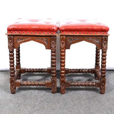 Lot 510 - A pair of oak bobbin turned stools, carved frieze.