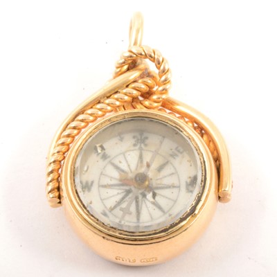 Lot 290 - A yellow metal compass fob.