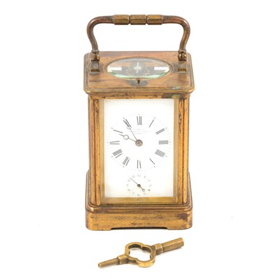 Lot 133 - A carriage style repeating clock striking on the hour and half hour with alarm.