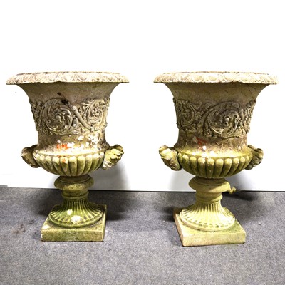 Lot 595 - Pair of reconstituted stone campana-shape garden urns.