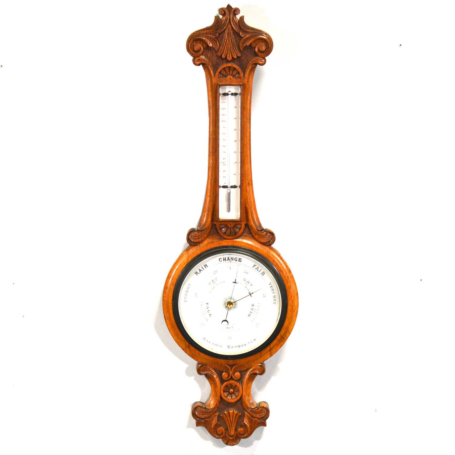 Lot 494 - Edwardian carved oak aneroid barometer with thermometer