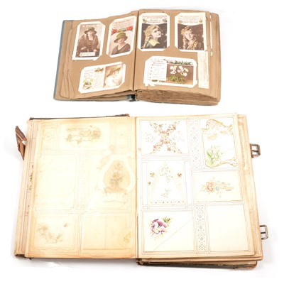 Lot 153 - A Victorian scrapbook and album of postcards