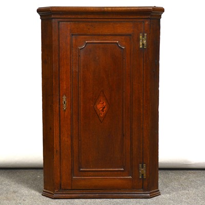 Lot 450 - George III oak hanging corner cupboard