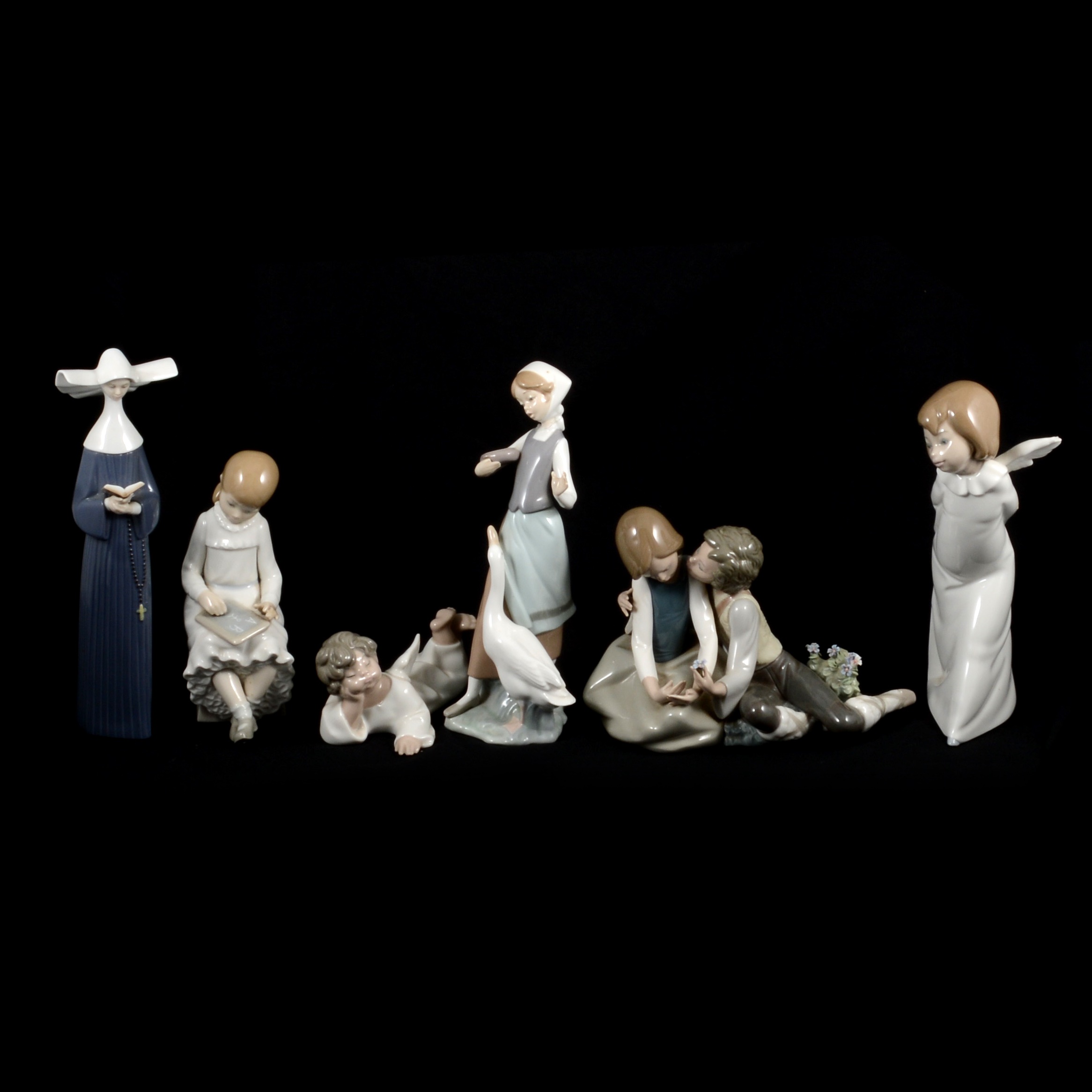 Lot 42 Eleven Lladro and Nao figurines