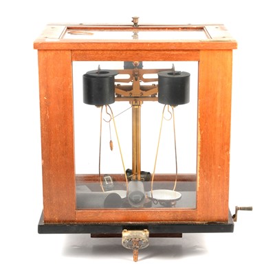 Lot 122 - Two early 20th century microscopes and a balancing machine.