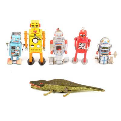 Lot 218 - Five tin-plate clock-work retro robot toys, and a crocodile.