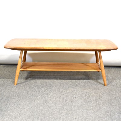 Lot 423 - Ercol elm and beech coffee table with magazine undertier